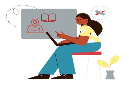 instructor sits and works on her course