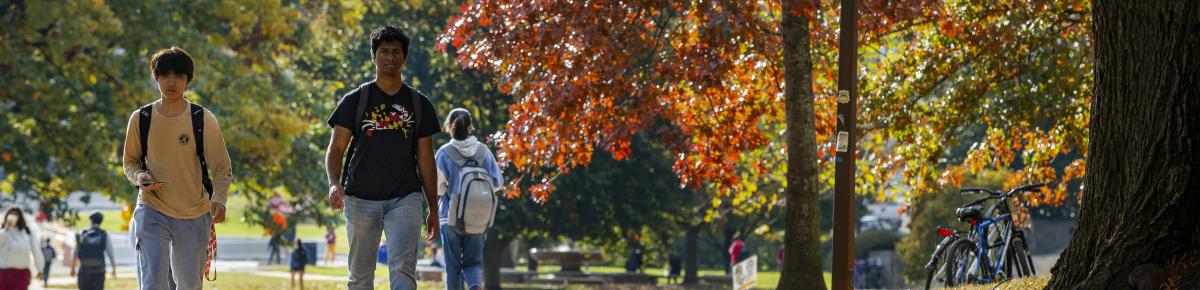 Students walk on the UMD campus during the fall