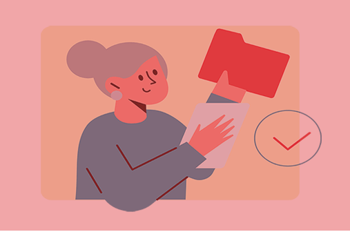 White woman with grey hair holds up a red file folder