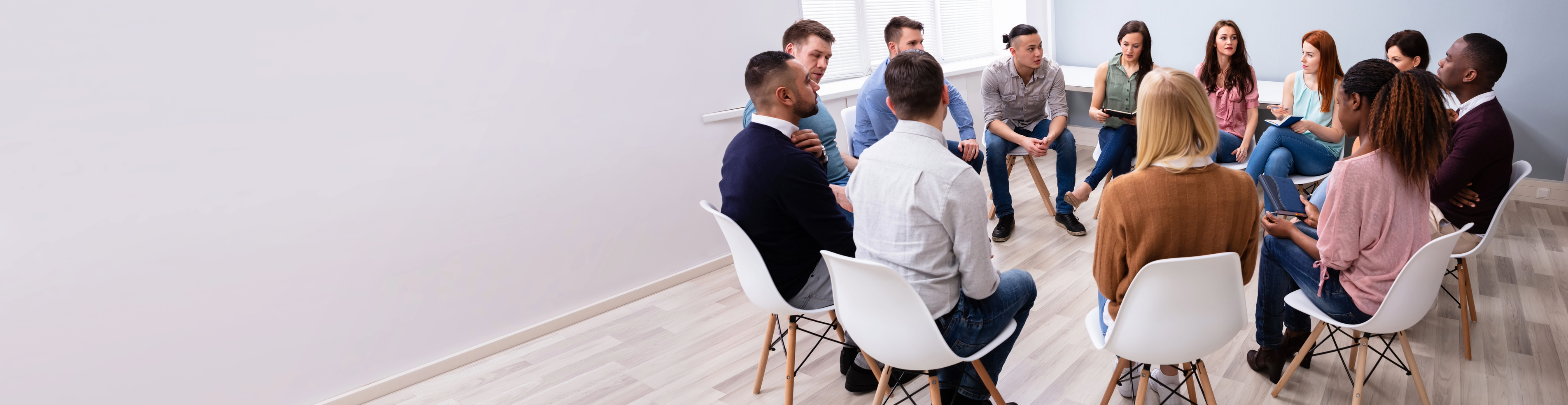 Group of people sitting in a circle 